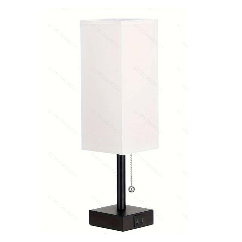 Modern square linen desk lamp with USB charging ports and 3-color dimmable lighting on a minimalist nightstand

