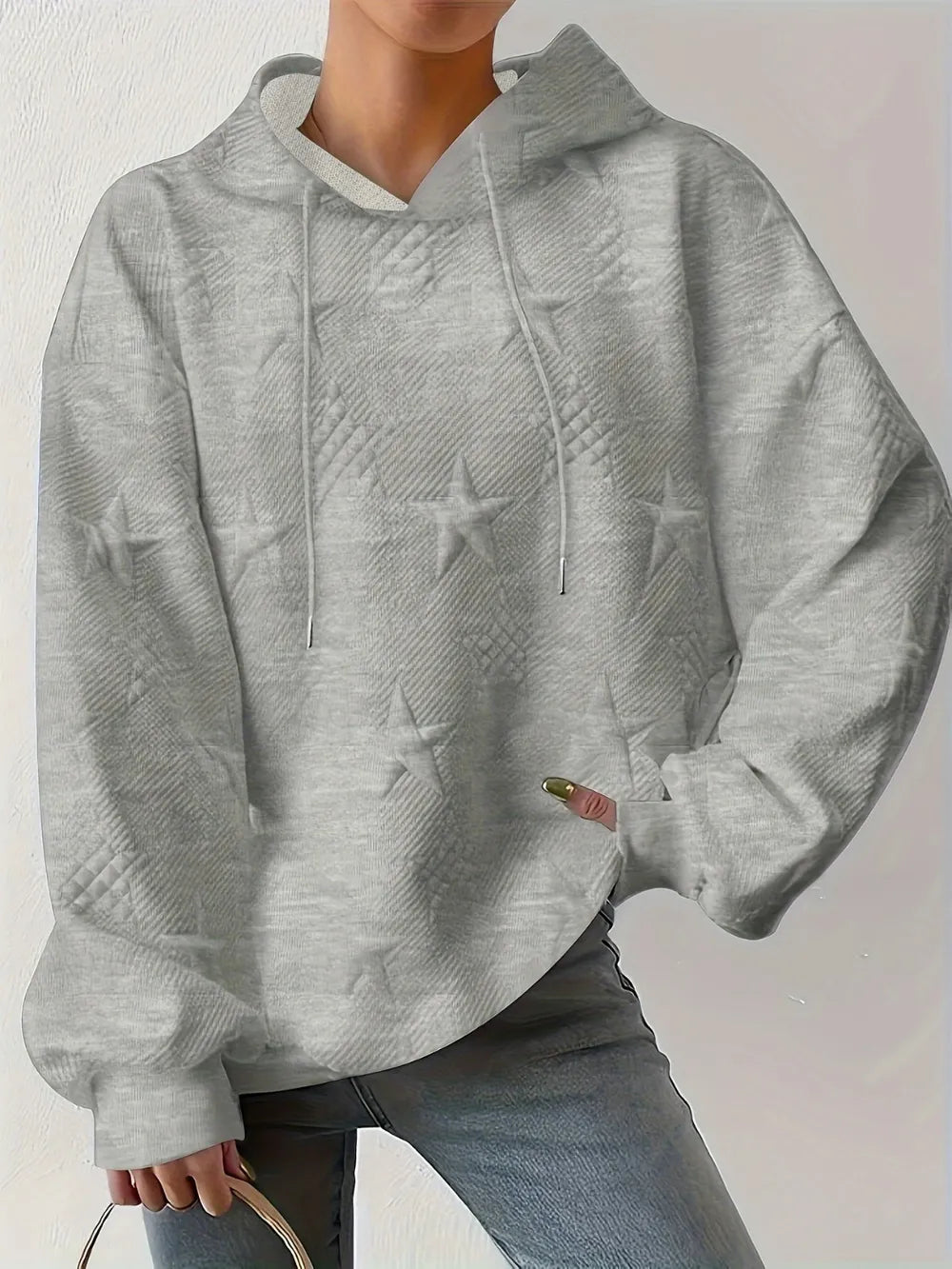 White women’s casual pullover hoodie with star texture and drawstring hood.








