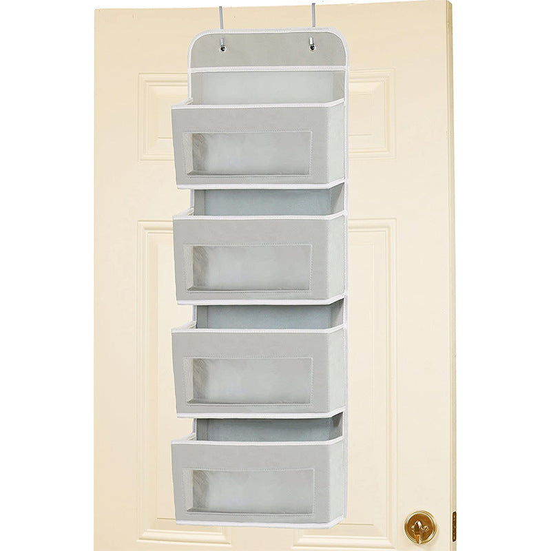 5-pocket hanging organizer on the back of a white bedroom door


