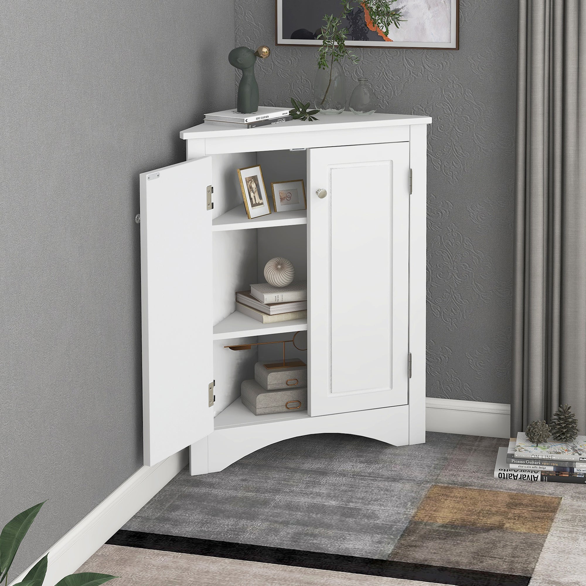 White triangle bathroom storage cabinet with a compact, space-saving design, featuring multiple shelves for organizing toiletries, towels, and other bathroom essentials. Made from durable materials, this sleek cabinet adds a functional and stylish touch to any bathroom decor.