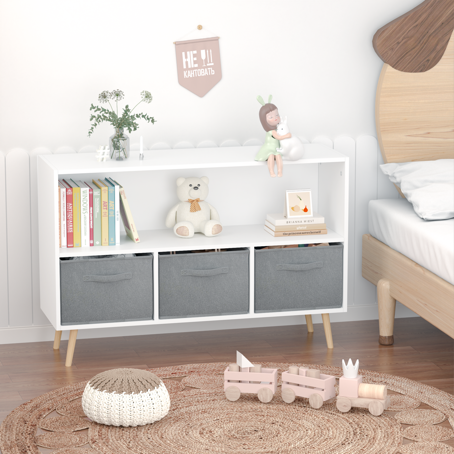 White kids bookcase with gray fabric drawers and books displayed