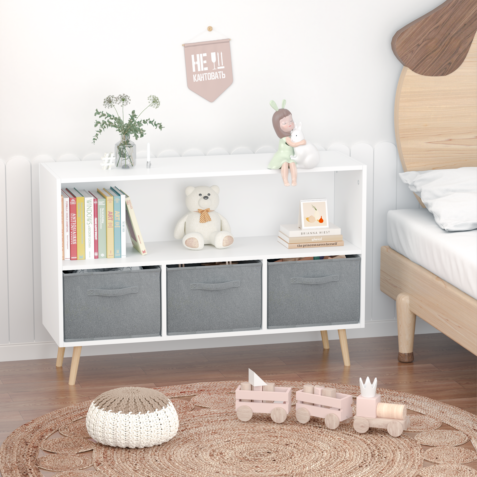 White kids bookcase with gray fabric drawers and books displayed