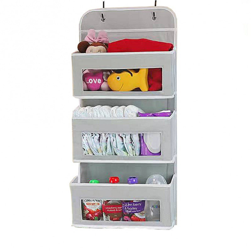 5-pocket hanging organizer on the back of a white bedroom door

