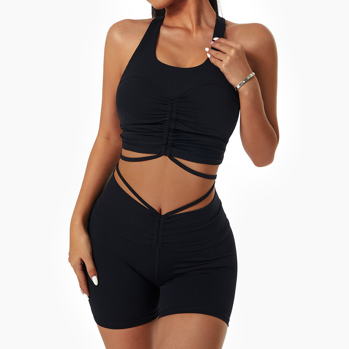 Woman wearing a stylish yoga set with drawstring collar top and fitted leggings, ideal for gym or yoga sessions.

