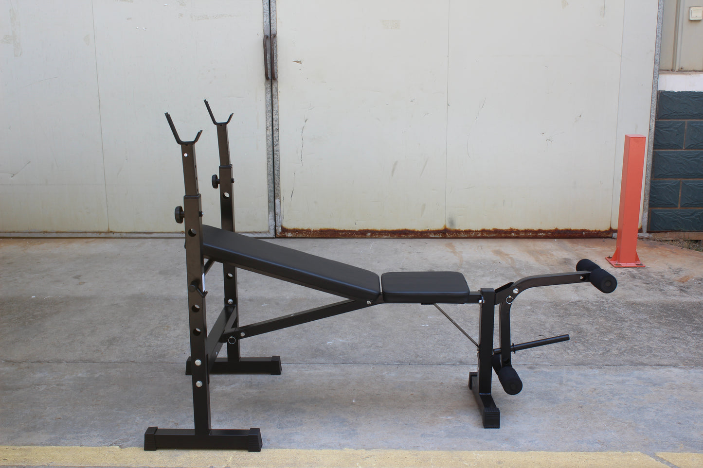 Olympic weight bench with adjustable squat rack, designed for strength training, featuring sturdy construction and multiple settings for bench press, squats, and other weightlifting exercises.