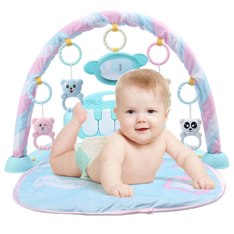 Baby playmat with keyboard, mirror, and hanging toys for newborn sensory development.

