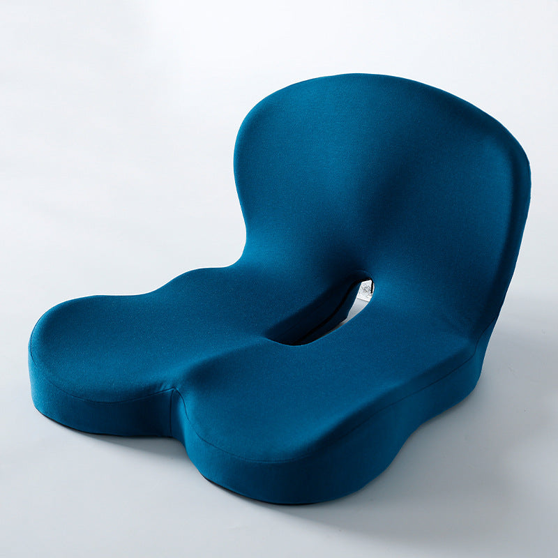 Memory foam ergonomic cushion with integrated back and seat support on an office chair

