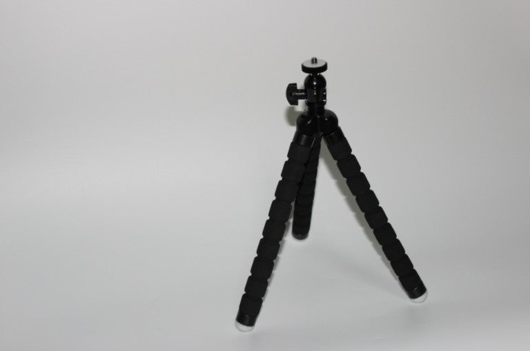 Mini octopus tripod stand holding smartphone for vlogging