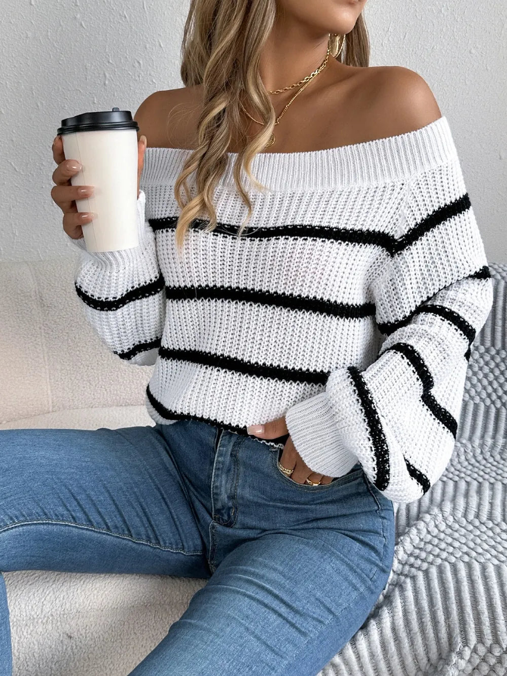 Women's striped off-shoulder sweater with long sleeves, front view

