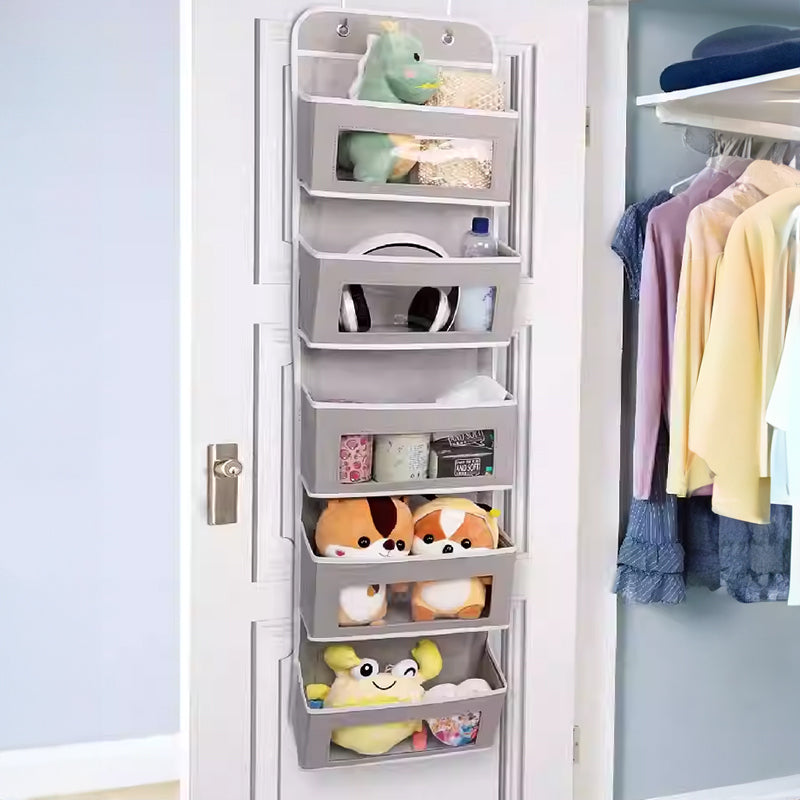 5-pocket hanging organizer on the back of a white bedroom door

