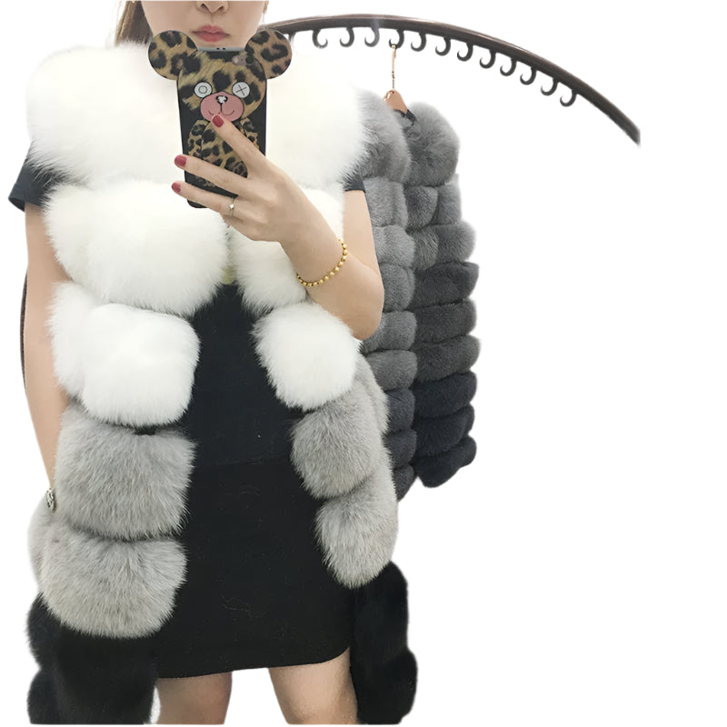 Woman wearing a colorful patchwork faux fur vest in winter setting