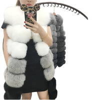 Woman wearing a colorful patchwork faux fur vest in winter setting