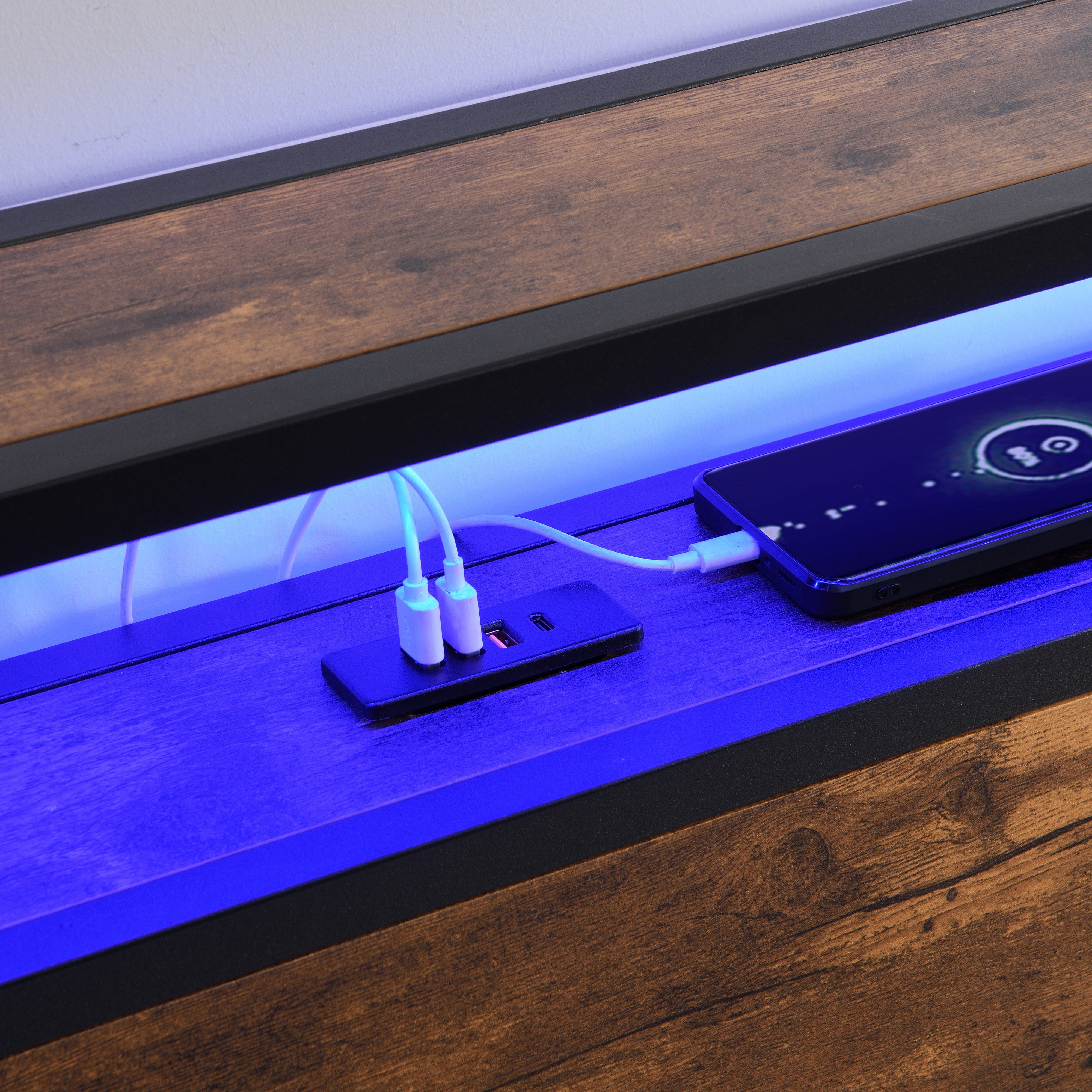 Full-size bed frame with LED headboard, drawers, and charging ports