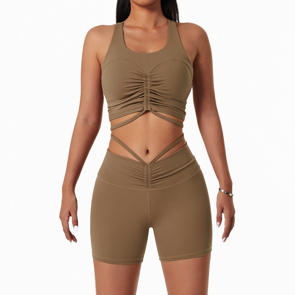 Woman wearing a stylish yoga set with drawstring collar top and fitted leggings, ideal for gym or yoga sessions.

