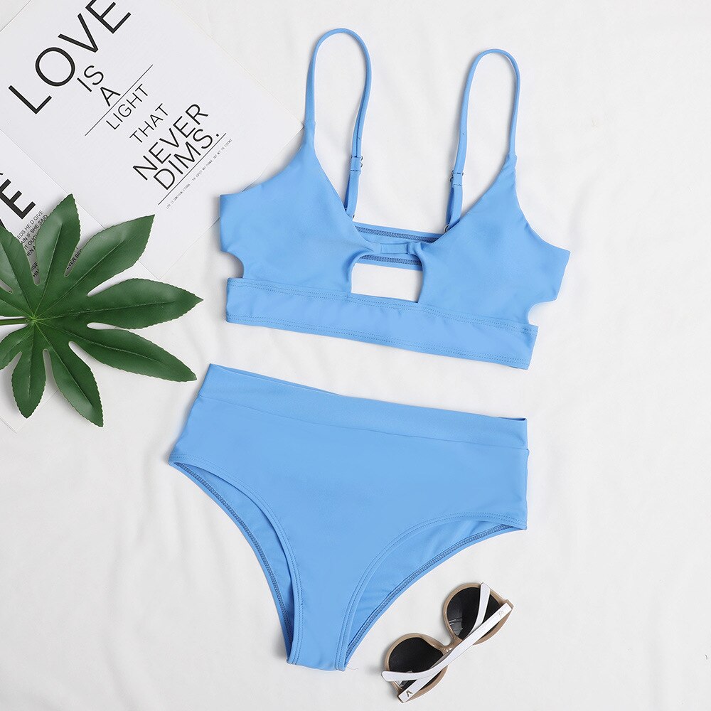 Surf Siren high-waist bikini featuring a retro-inspired design with a flattering high-waisted bottom for added comfort and support. Made from stretchy, durable fabric, perfect for beach days, poolside lounging, and stylish summer fun.