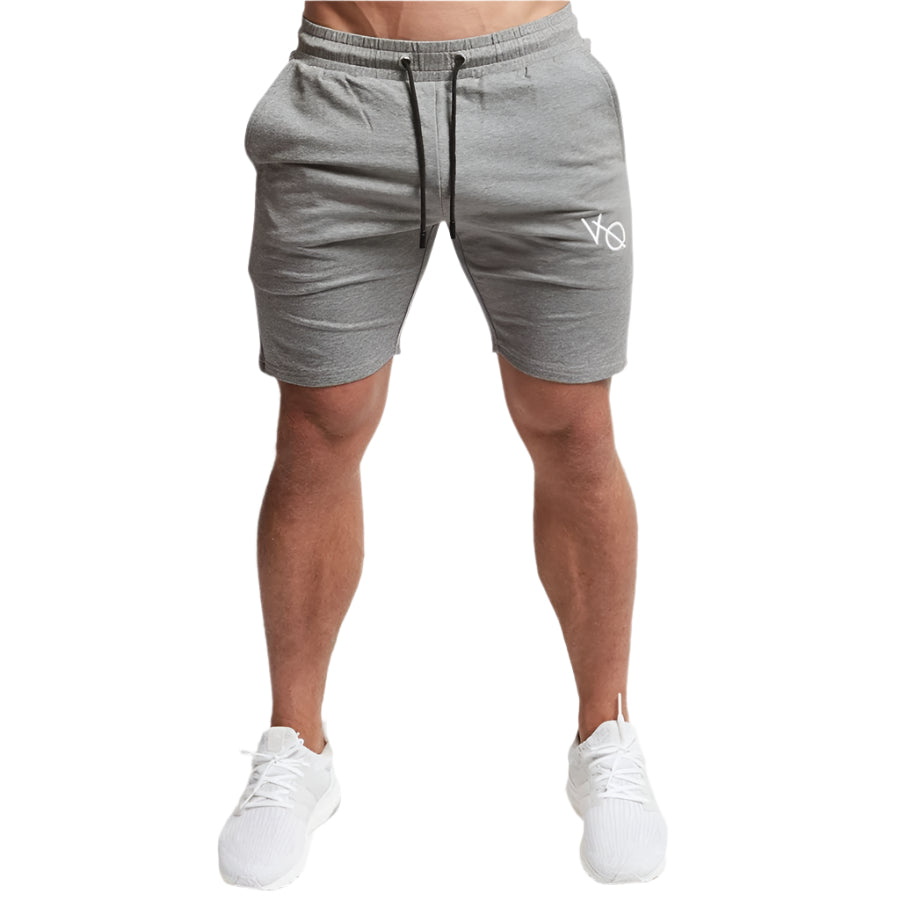 "Men's workout running shorts made from lightweight, moisture-wicking fabric for comfort and breath ability. The shorts feature an elastic waistband with an adjustable drawstring, side pockets, and a relaxed fit, perfect for running or intense workout sessions."
