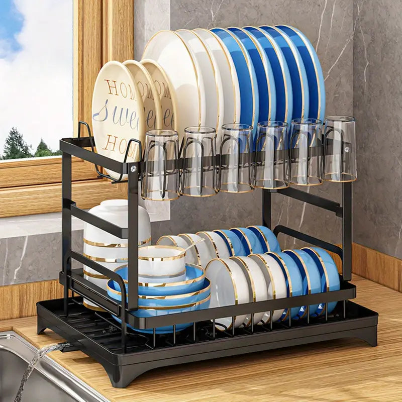 Kitchen drainage rack with bowls, plates, and utensils drying on a countertop

