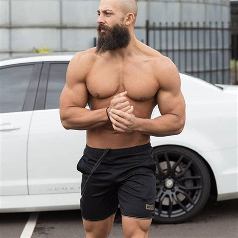 "Men’s quick-dry running shorts made from moisture-wicking fabric, featuring an elastic waistband and lightweight design for comfort and performance during runs."