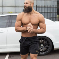 "Men’s quick-dry running shorts made from moisture-wicking fabric, featuring an elastic waistband and lightweight design for comfort and performance during runs."