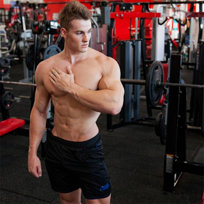 "Men’s quick-dry running shorts made from moisture-wicking fabric, featuring an elastic waistband and lightweight design for comfort and performance during runs."