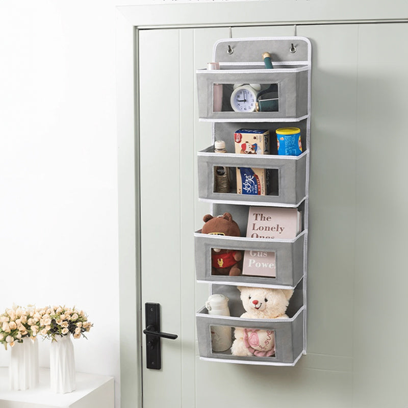 5-pocket hanging organizer on the back of a white bedroom door

