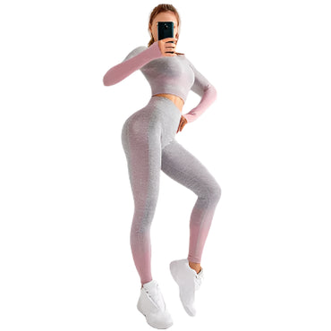 "Women’s seamless yoga set consisting of a high-waisted, form-fitting pair of leggings paired with a matching sports bra. The set features a smooth, stretchy, and breathable fabric, designed in a minimalist style for maximum comfort and flexibility during yoga or fitness activities."