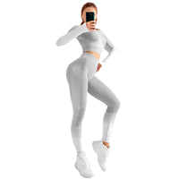 "Women’s seamless yoga set consisting of a high-waisted, form-fitting pair of leggings paired with a matching sports bra. The set features a smooth, stretchy, and breathable fabric, designed in a minimalist style for maximum comfort and flexibility during yoga or fitness activities."