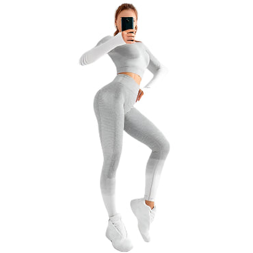 "Women’s seamless yoga set consisting of a high-waisted, form-fitting pair of leggings paired with a matching sports bra. The set features a smooth, stretchy, and breathable fabric, designed in a minimalist style for maximum comfort and flexibility during yoga or fitness activities."