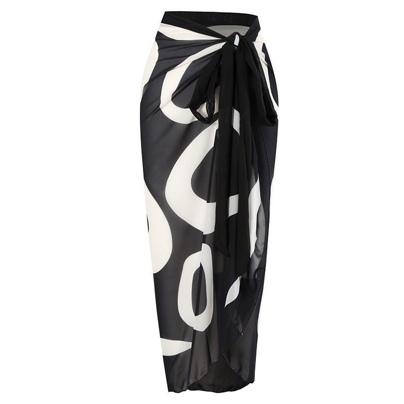 Black and White Printing Color Contrast Shoulder Belt Jumpsuit – Modern design with a unique shoulder belt and breathable sunscreen gauze skirt for a comfortable, chic look.








