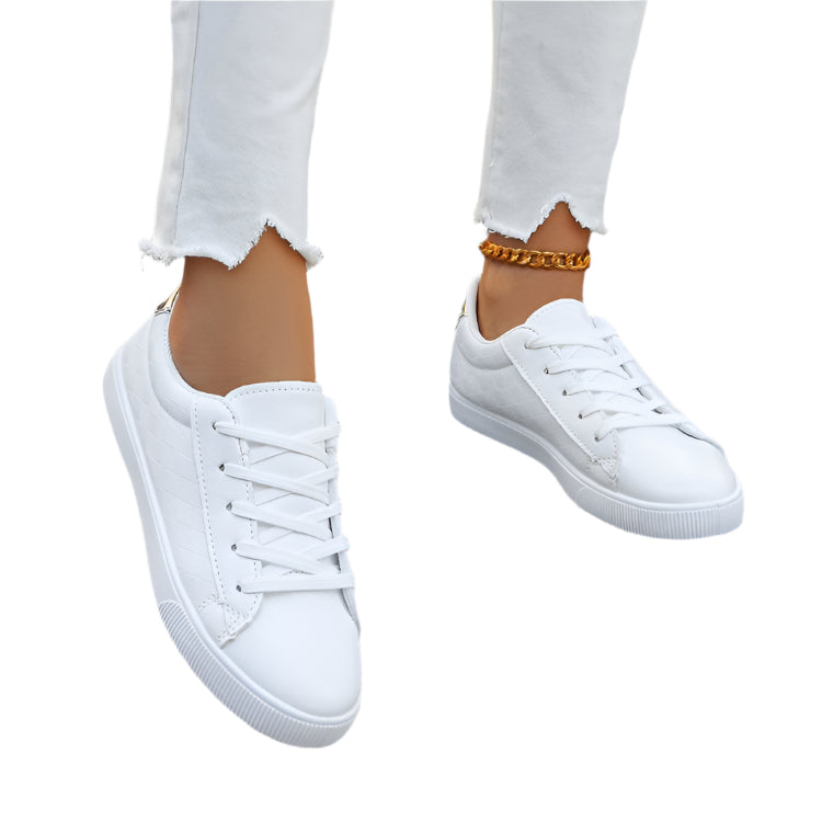 Women's plus-size sneakers with lace-up front, offering comfort and style in a classic white color for casual and sports wear.








