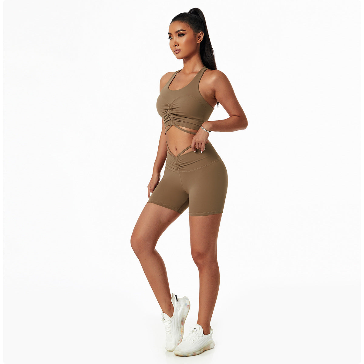 Woman wearing a stylish yoga set with drawstring collar top and fitted leggings, ideal for gym or yoga sessions.

