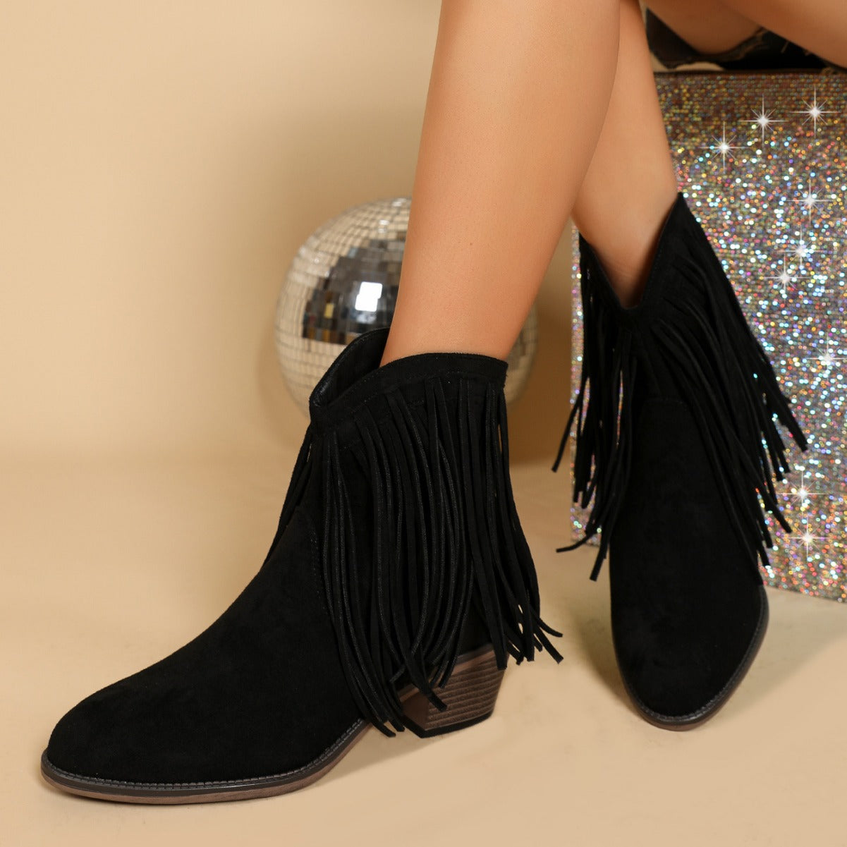 Women’s retro chunky heel Martin boots with pointed toe and tassel details.

