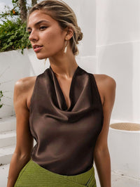 Women’s solid color swing collar sleeveless vest with halter neckline and backless design.

