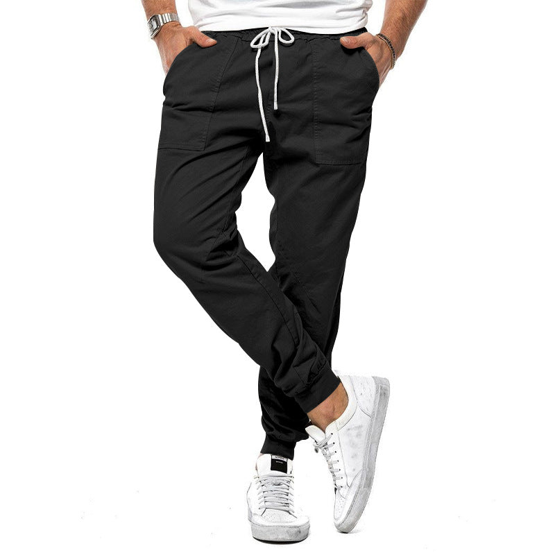 Loose tapered fit casual pants for men, perfect for spring and autumn, with multiple pockets and a stylish, comfortable design for outdoor or leisure wear.