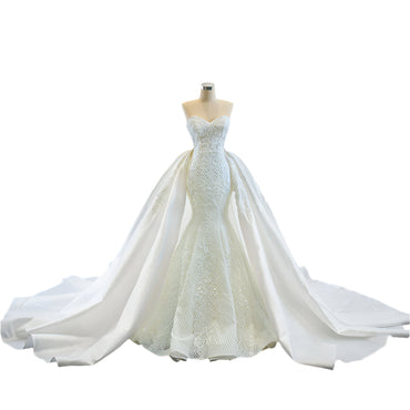 Elegant strapless tube top wedding dress with a fishtail silhouette, detachable flowing train, and intricate lace details for a dreamy bridal look.

