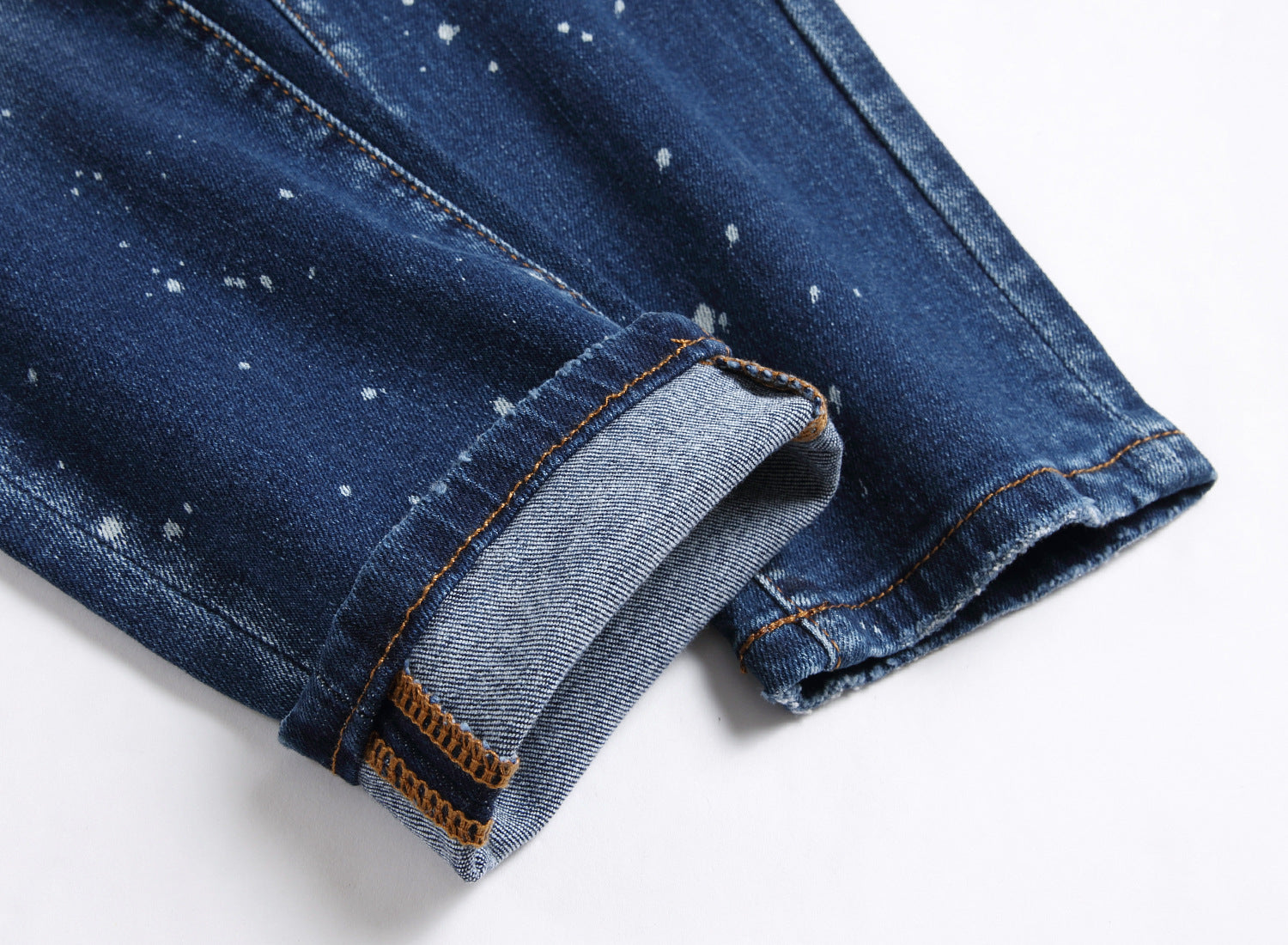 Men’s ripped fashion jeans with ornamental details, slim fit, and distressed design for a trendy streetwear look.