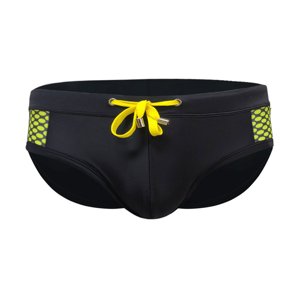 Men’s close-fitting swim briefs with polka dot stitching, designed for beach and sports activities.

