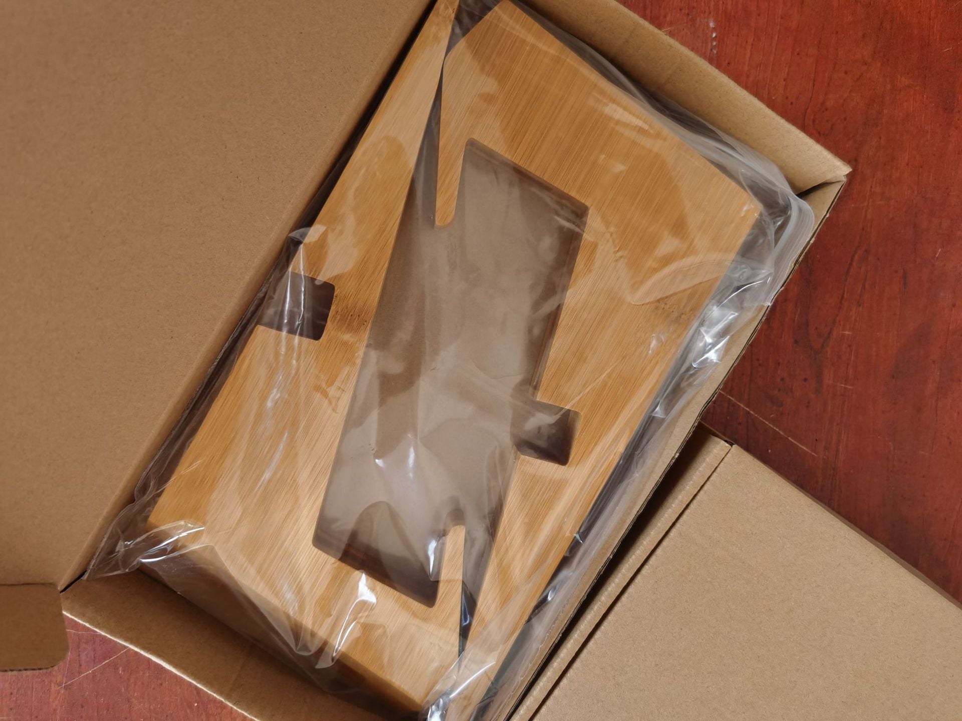 Wooden tabletop menu and book stand used for restaurants, kitchens, or desktop reading.

