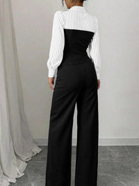 Person wearing a white blouse with a black waistcoat and wide-leg pants against a plain background