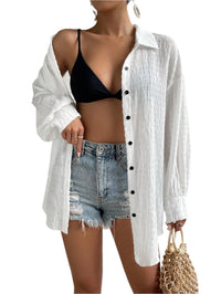 Women’s drop shoulder button front kimono long sleeve top with relaxed fit and button detailing.

