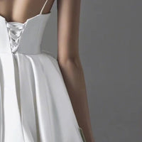 Elegant plus-size wedding dress with lace detailing and a flattering silhouette for modern brides.

