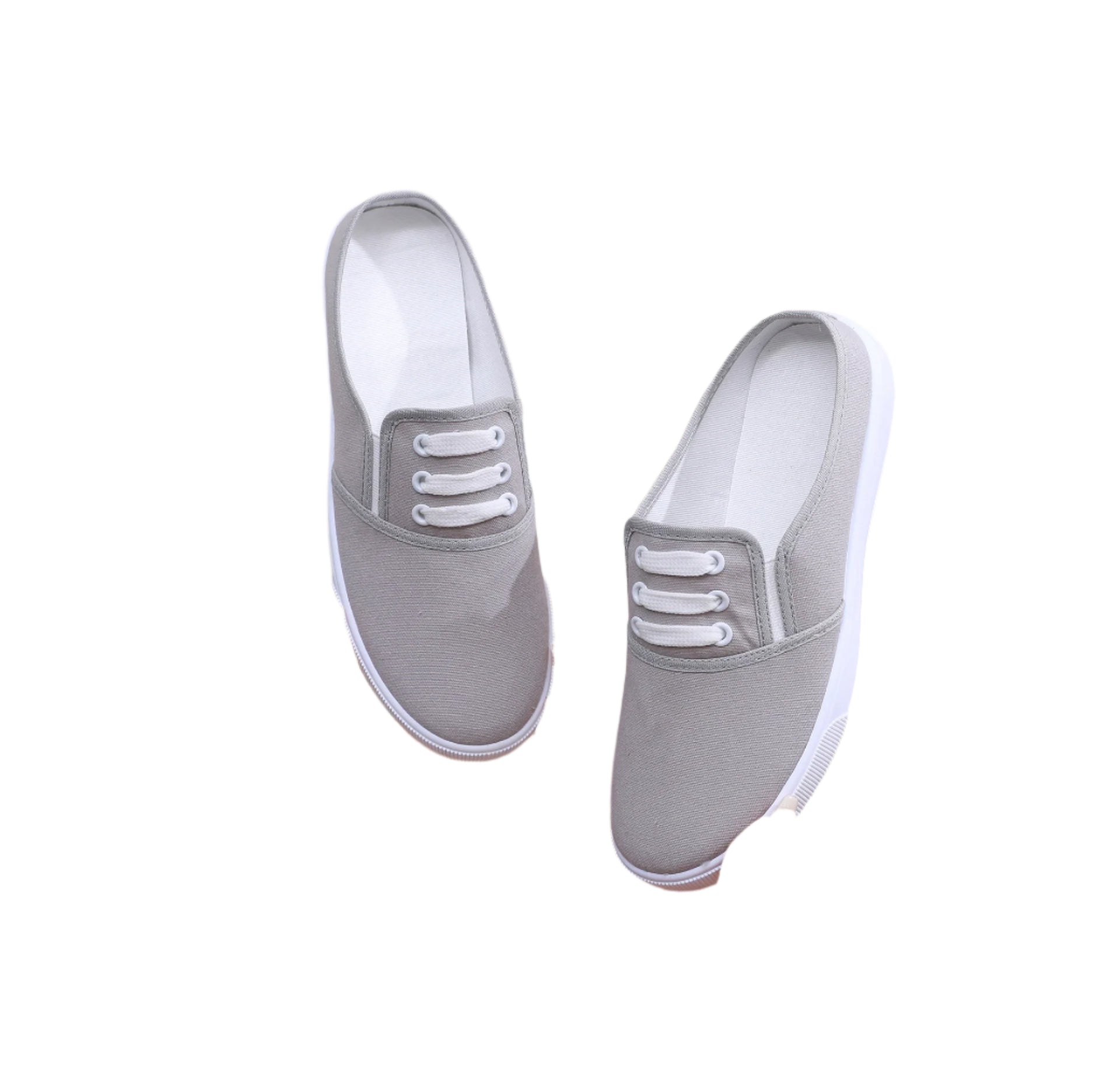 Comfortable slip-on canvas shoes for women with a flat sole, breathable upper, and versatile style, perfect for casual outings.








