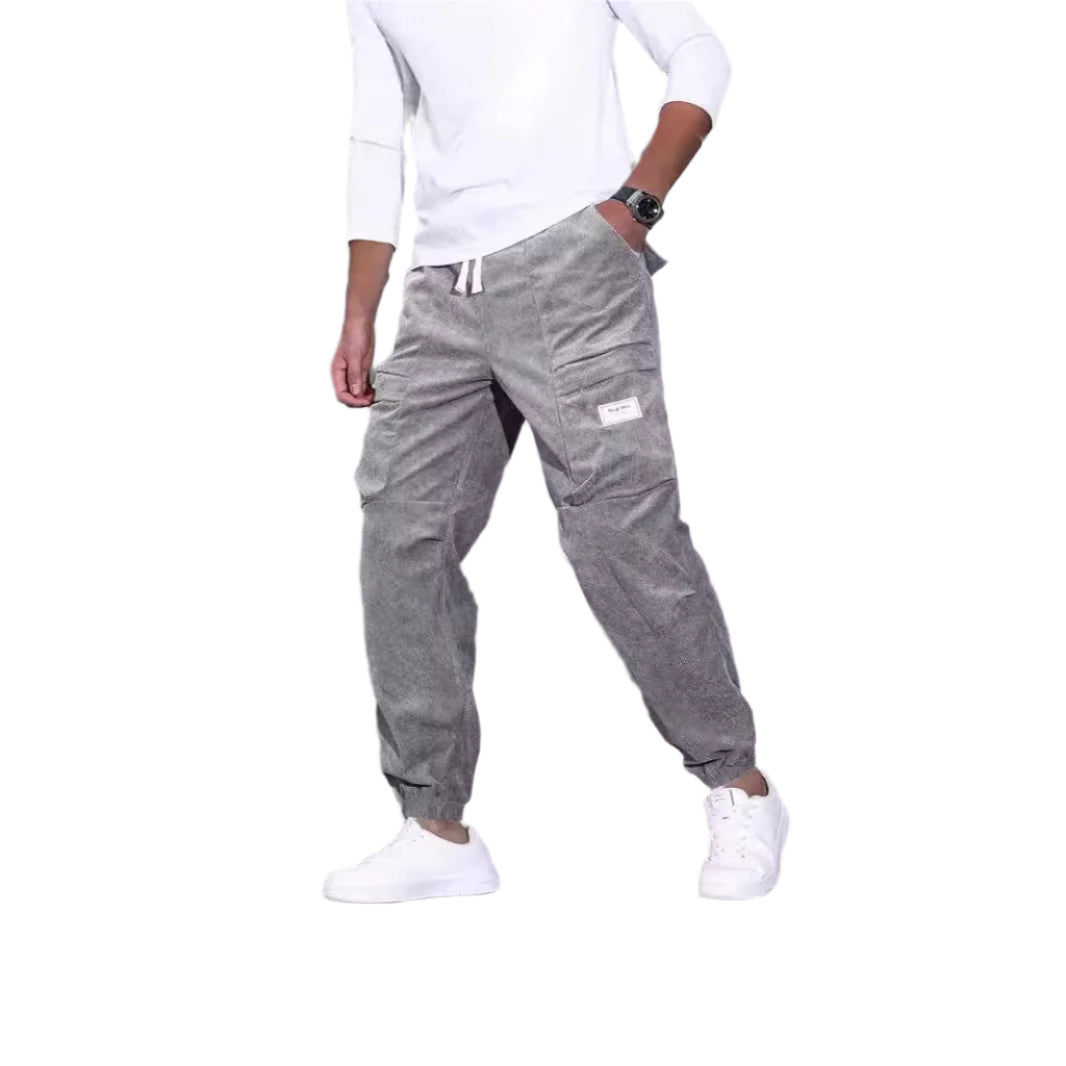 Men's corduroy overalls with ankle-tied loose fit and multi-pocket design for casual wear.