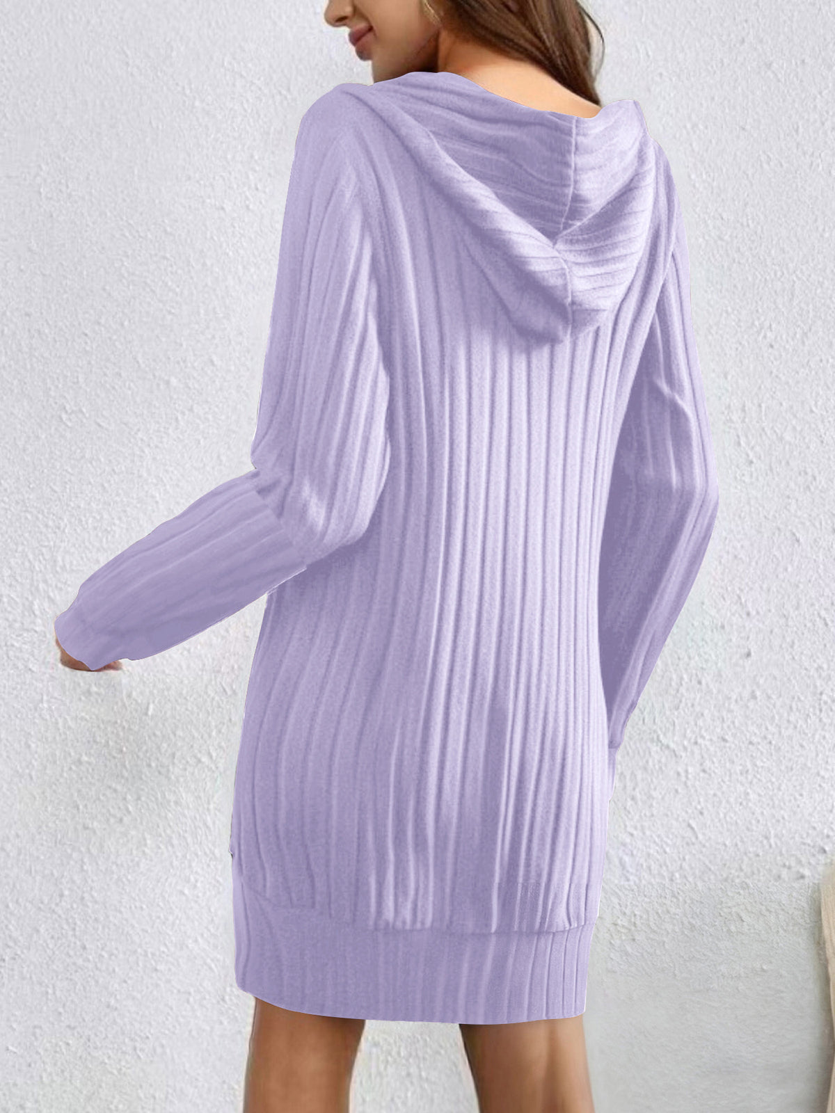 Light purple ribbed sweater dress worn by a person on a white background