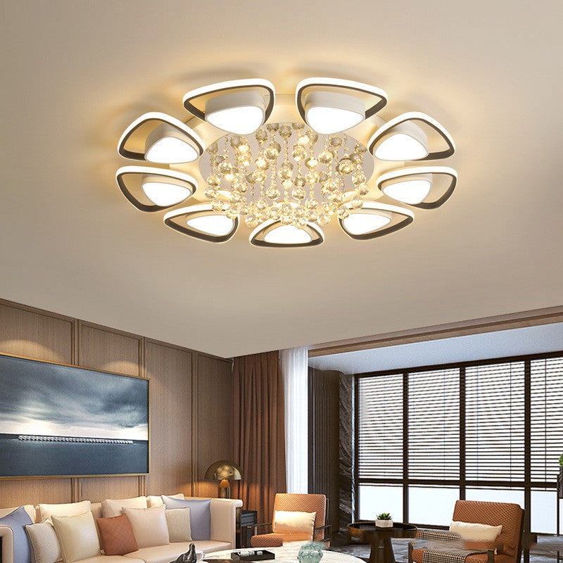 High-end modern ceiling light illuminating a cozy bedroom with elegant decor

