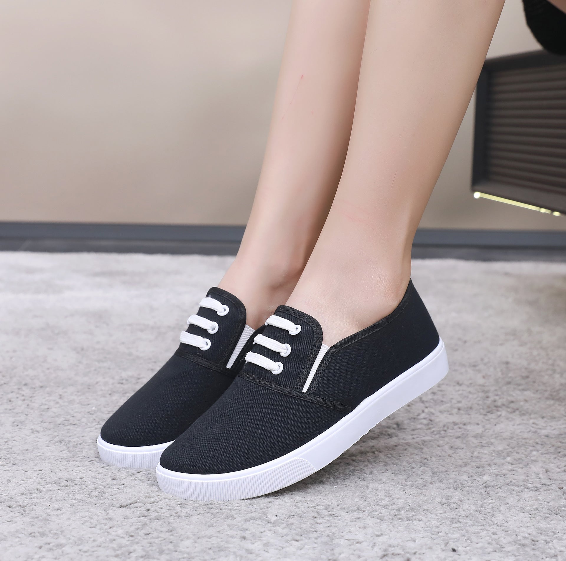 Comfortable slip-on canvas shoes for women with a flat sole, breathable upper, and versatile style, perfect for casual outings.








