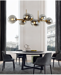 Modern Nordic minimalist glass chandelier lighting in living room setting

