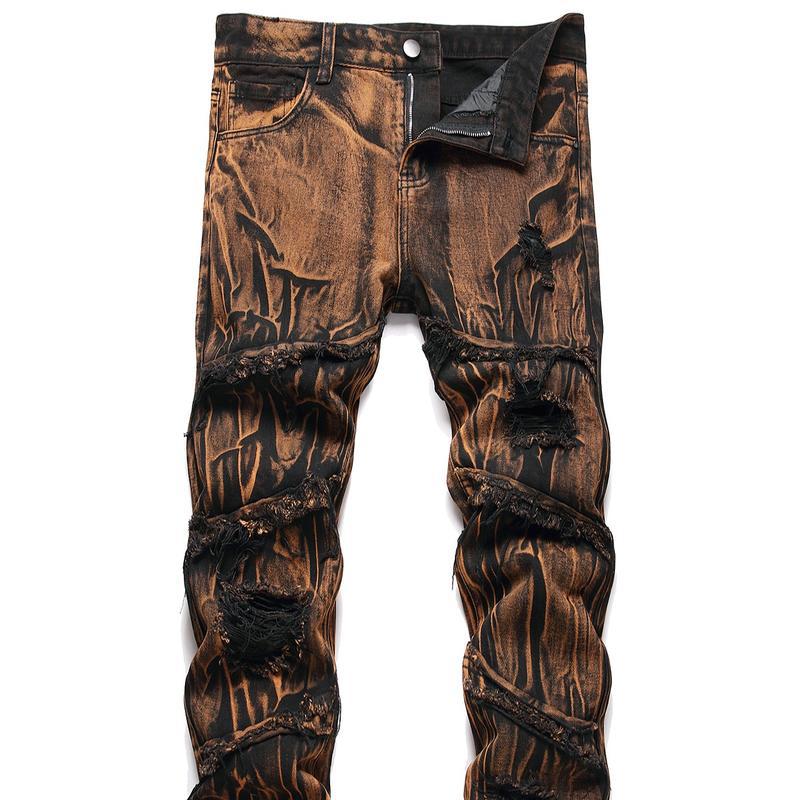 Detailed view of men's slim-fit ripped jeans with decorative moto zippers