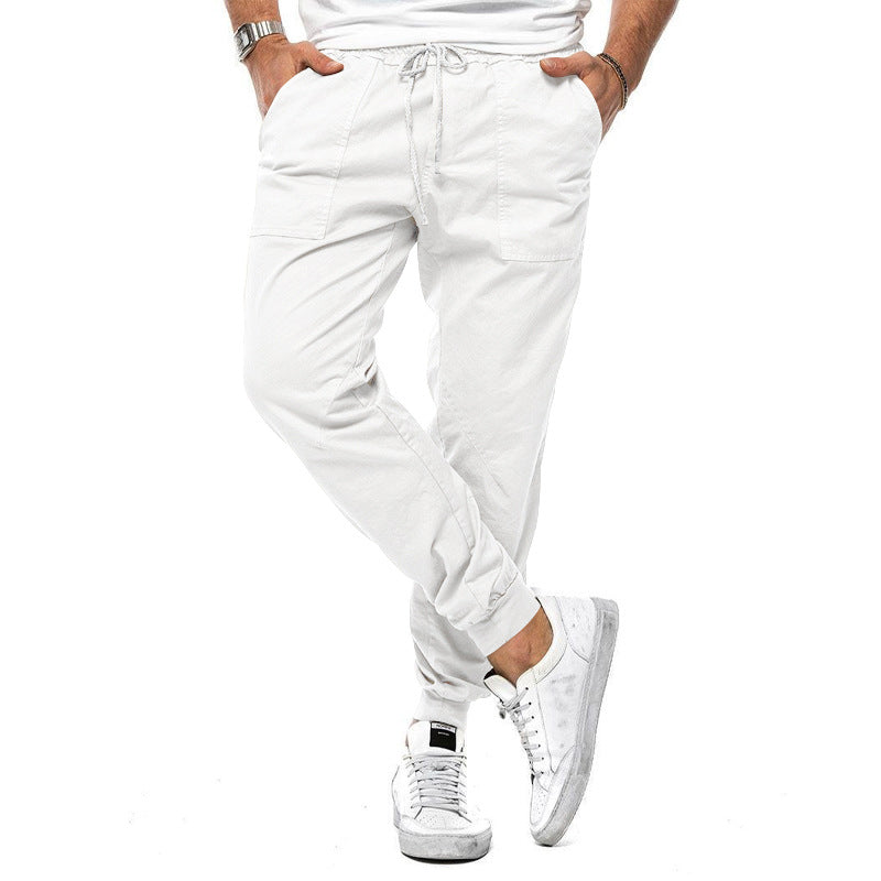 Loose tapered fit casual pants for men, perfect for spring and autumn, with multiple pockets and a stylish, comfortable design for outdoor or leisure wear.