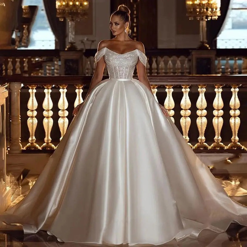 “Falling For You A Line Off Shoulder Wedding Dress – romantic off-shoulder bridal gown with a flattering A-line silhouette – Hot Deal Warehouse bridal”
